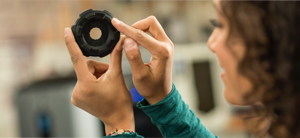 Woman examining a 3D Printed Part